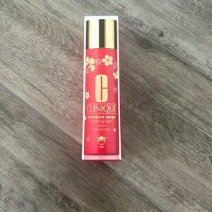 Clinique Moisture Surge Lotion in Pink and Gold